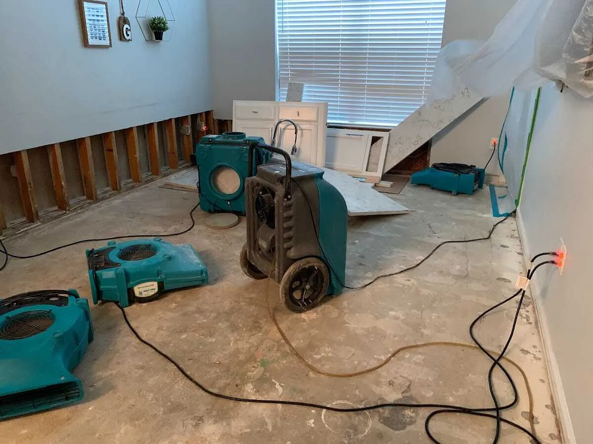 Dehumidifier in flood-cut room for Water Damage Restoration in Denver